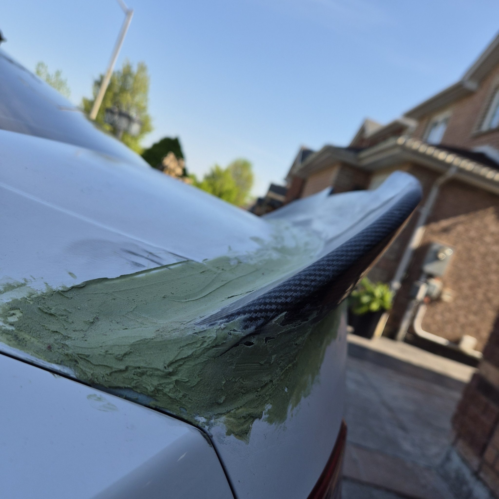 Duckbill spoiler being molded and shaped with filler