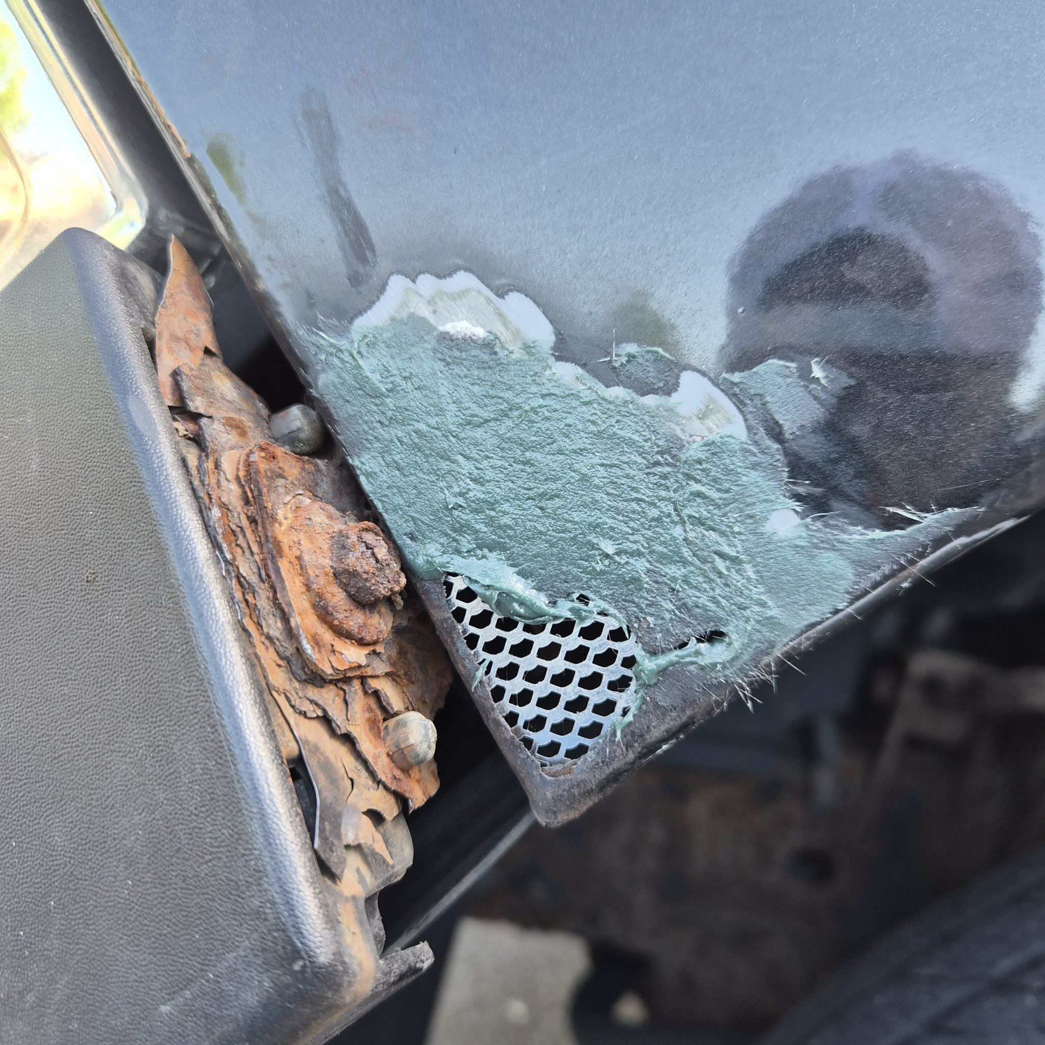 Ram cab corner rebuilt with mesh and green filler