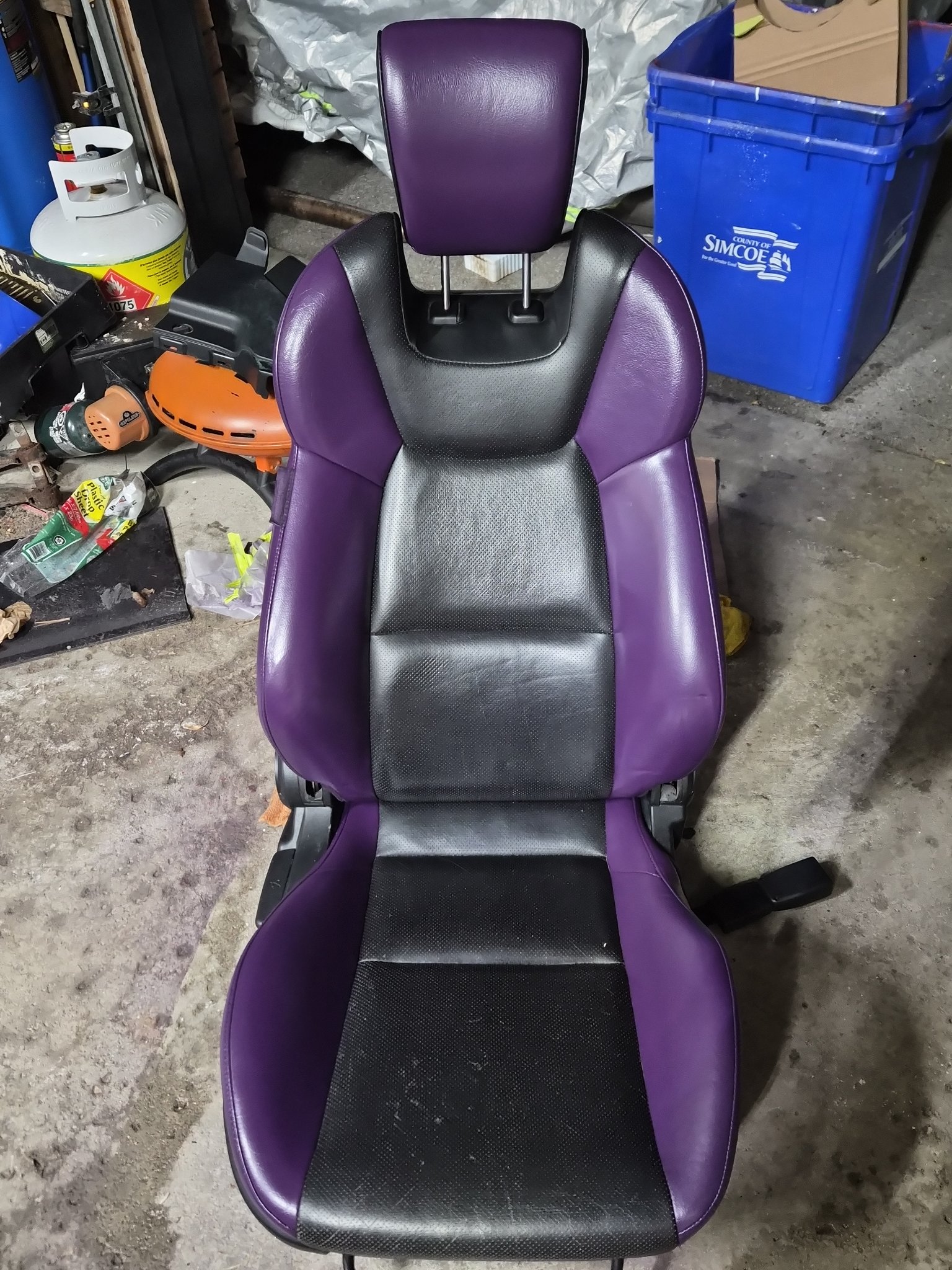 Leather seat finished in purple and black two-tone