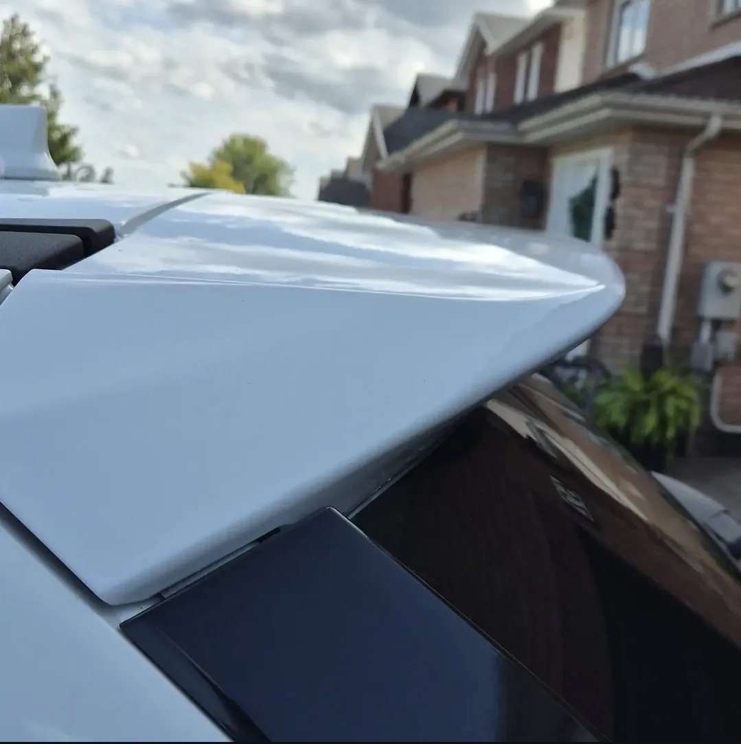 White spoiler freshly refinished in gloss white