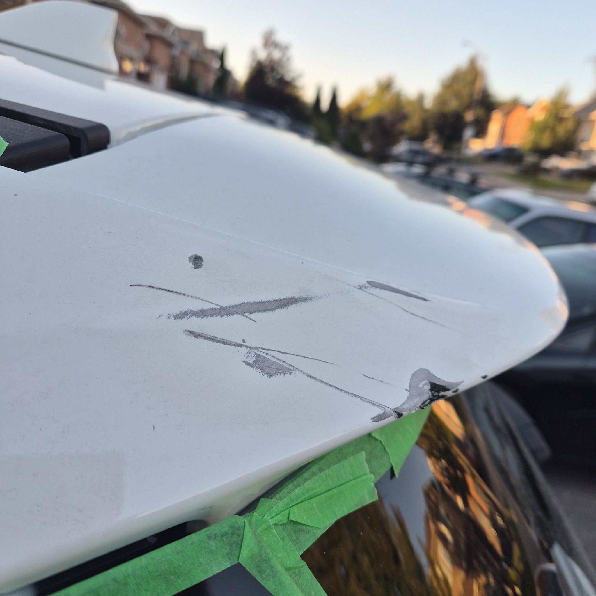 Spoiler edge with paint chips before refinishing