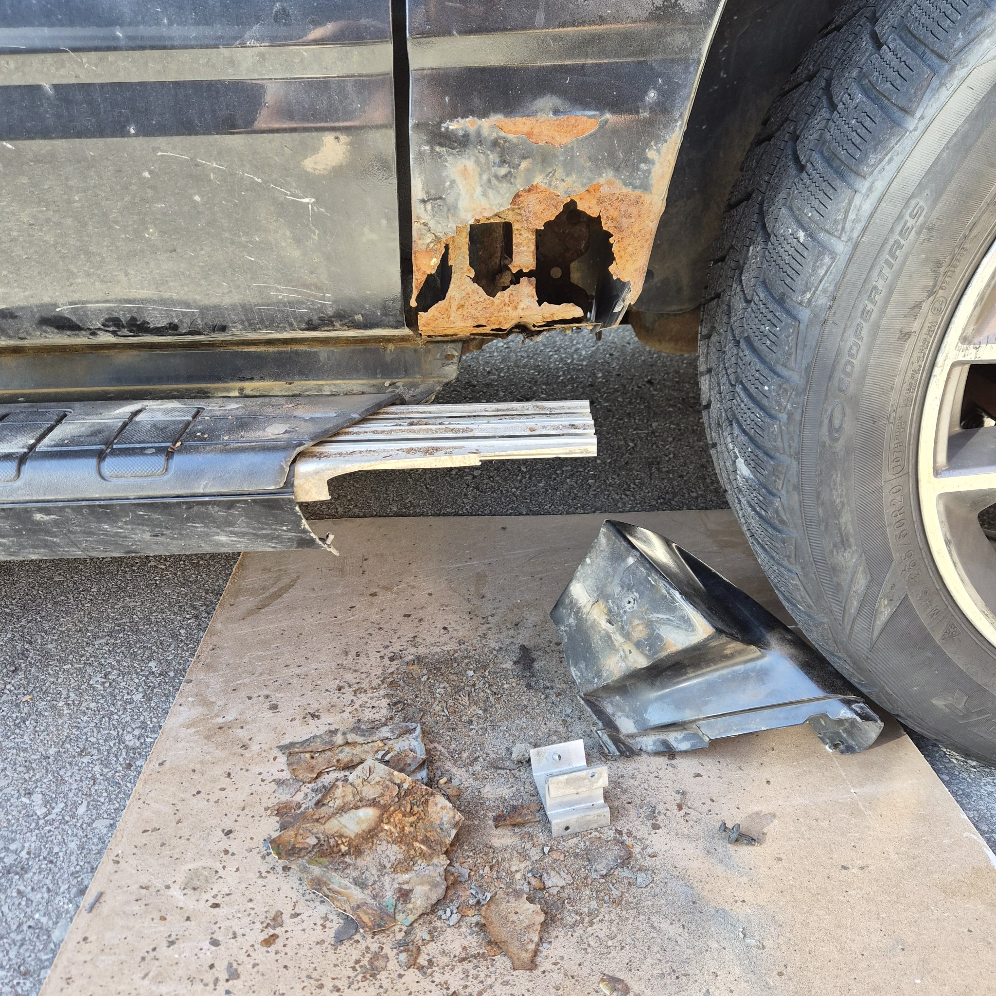 Ford Explorer Sport Trac lower fender with severe rust damage before repair